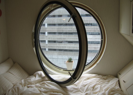 Nakagin Capsule Tower by Kisho Kurokawa, located in Shimbashi, Tokyo, Japan