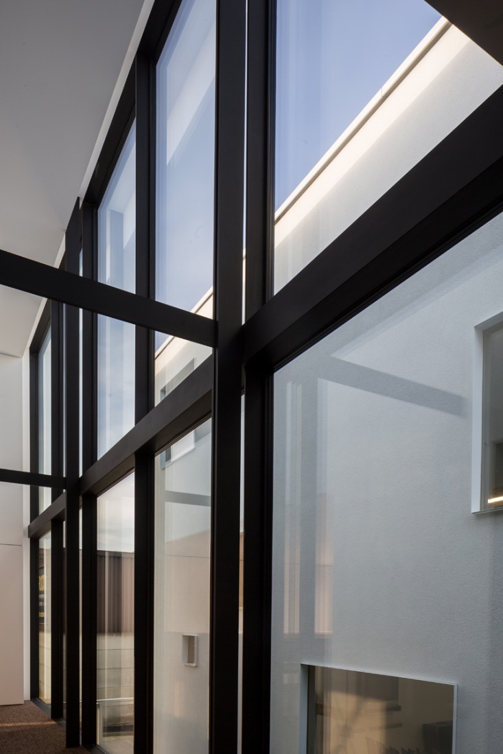 Inside view. Glass facade. Office LL by Caan Architecten. Photograph © Thomas De Bruyne – Cafeine.