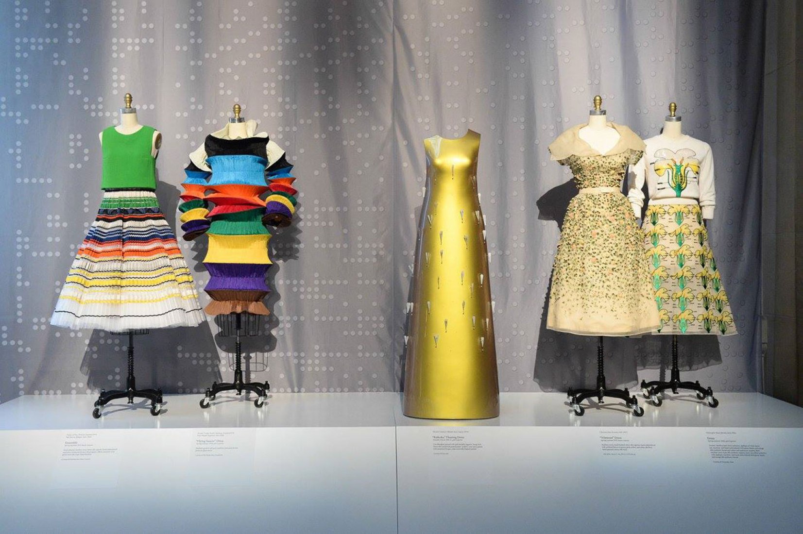 (from left) Christian Dior by Raf Simons ensemble, Issey Miyake for Miyake Design Studio “Flying Saucer” Dress, Hussein Chalayan “Kaikoku” Floating Dress, Christian Dior “Vilmiron” Dress, and Christopher Kane dress. Photography courtesy of BFA.com