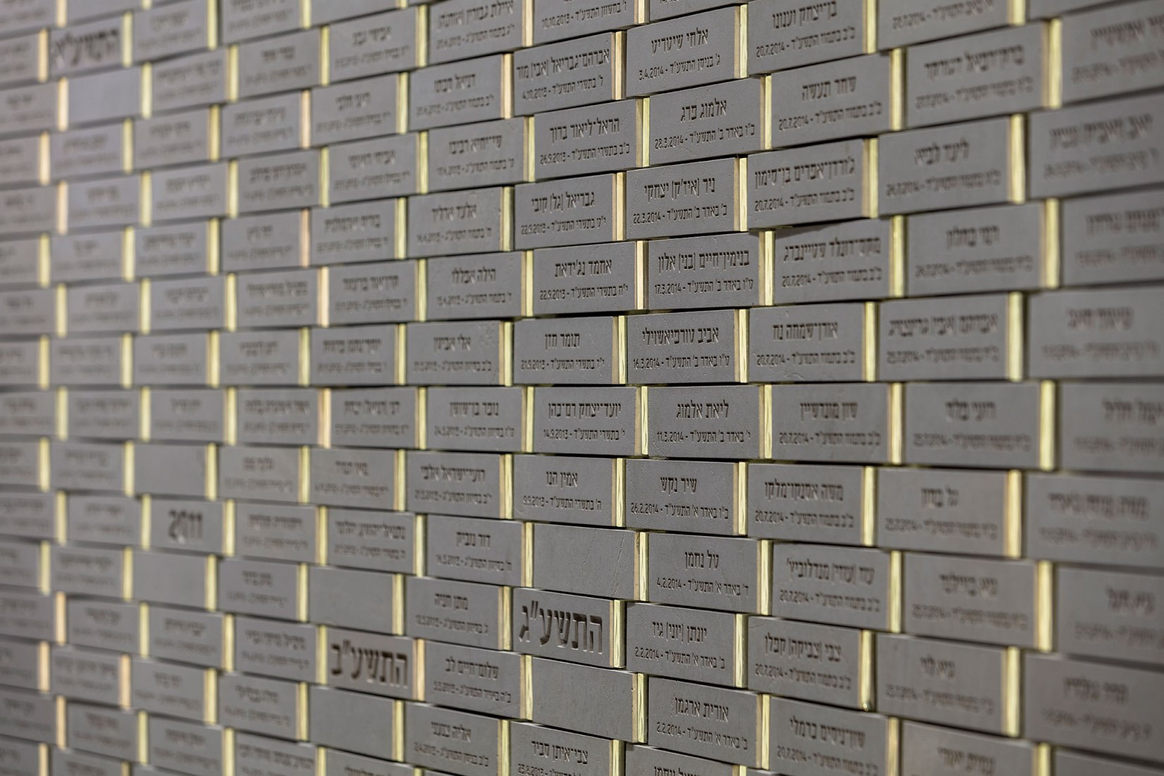 Bricks of "Wall of Names". The Mount Herzl Memorial Hall by Kimmel Eshkolot Architects. Photograph © Amit Geron Bricks of "Wall of Names". The Mount Herzl Memorial Hall by Kimmel Eshkolot Architects. Photograph © Amit Geron
