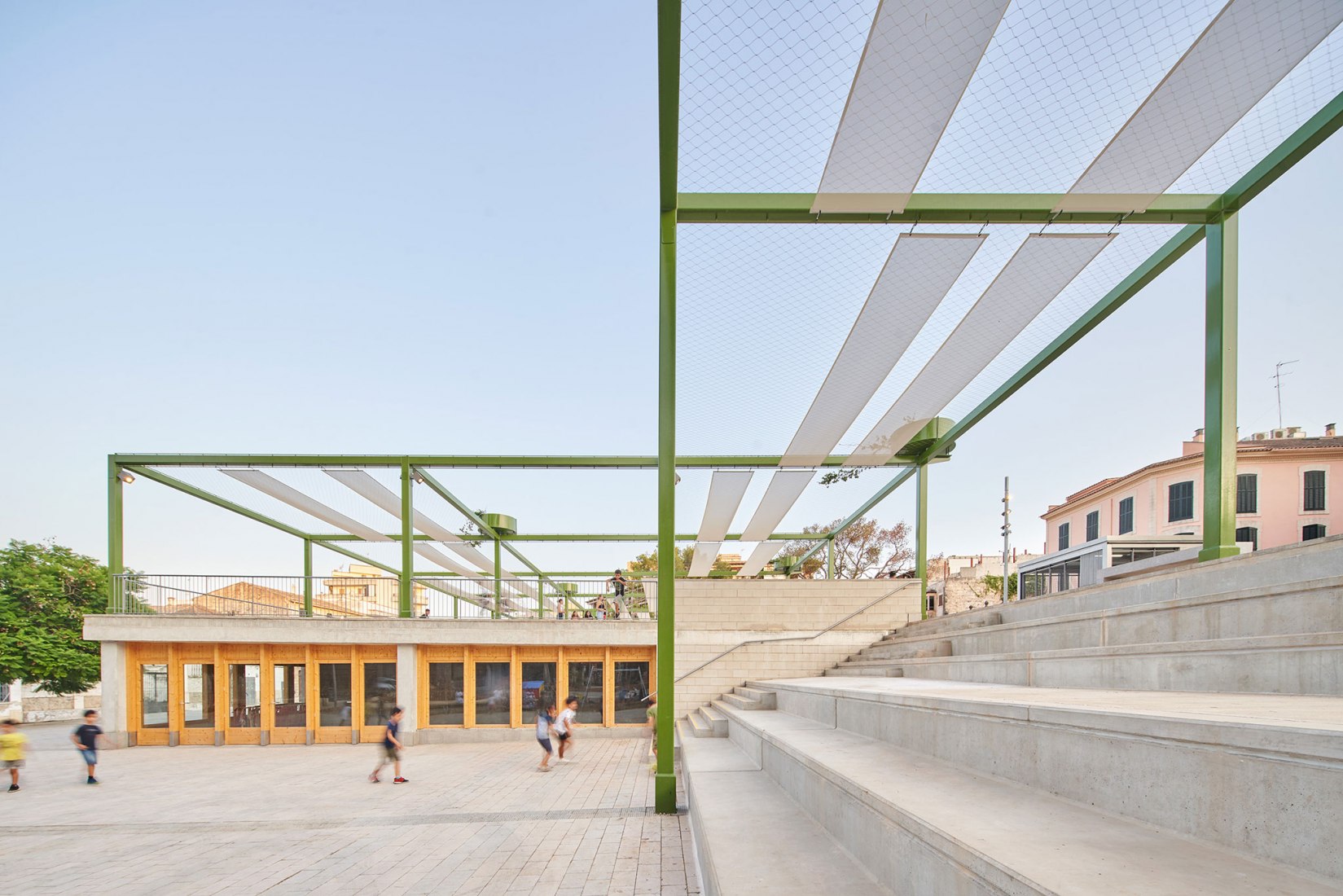 Elevation civic room, pergola, steps. Fonamental. Renovation of Plaza Mallorca by Son Estudi. Photography by Jose Hevia  Elevation civic room, pergola, steps. Fonamental. Renovation of Plaza Mallorca by Son Estudi. Photography by Jose Hevia