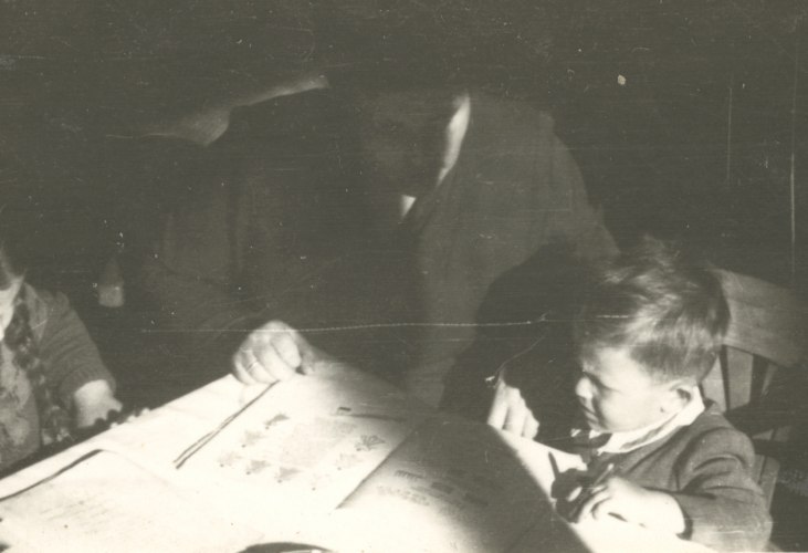 Dora Annette Daniel reading picture book 'Pan Tadeusz by Adam Mickiewicz', 1949, Lodz. Image courtesy of Barcelona Roca Gallery.