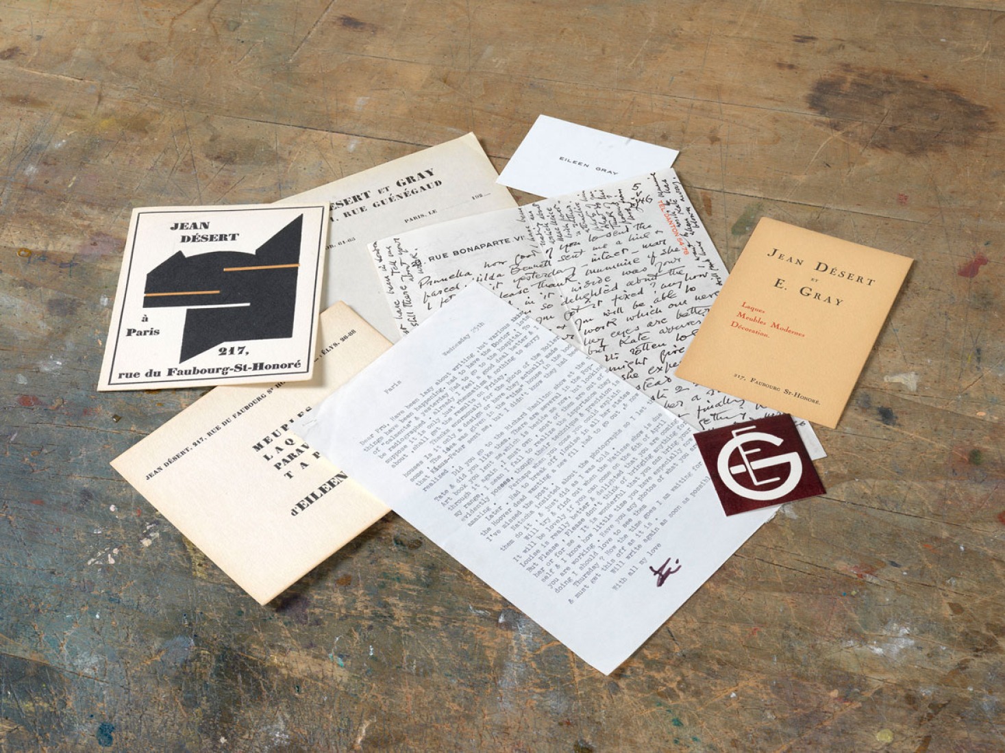 Stationery: handwritten and typed correspondence between Eileen Gray and Prunella Clough, visiting card, invitation card, advertisement and Eileen Gray label. Exhibition Eileen Gray: the private painter. Image courtesy of the Osborne Samuel Gallery.  Stationery: handwritten and typed correspondence between Eileen Gray and Prunella Clough, visiting card, invitation card, advertisement and Eileen Gray label. Exhibition Eileen Gray: the private painter. Image courtesy of the Osborne Samuel Gallery.