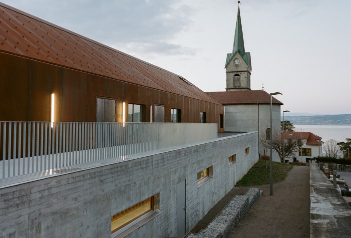 Looking out to the lake. Extension of school facility in Lugrin by ...